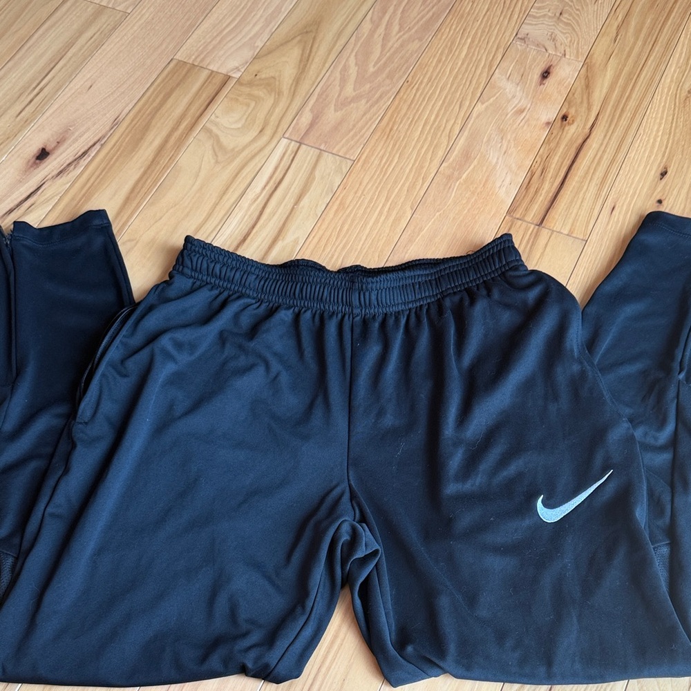 Nike Kids Black Joggers with Blue Swoosh